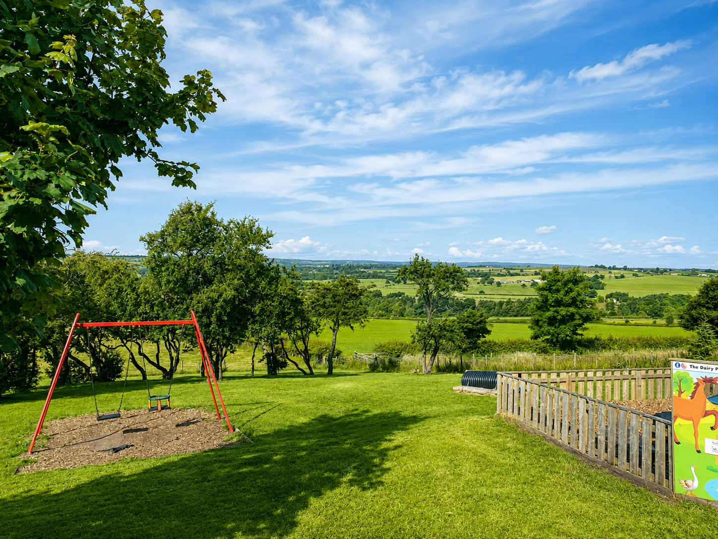 Countryside views and the outdoor play area at The Dairy Barn